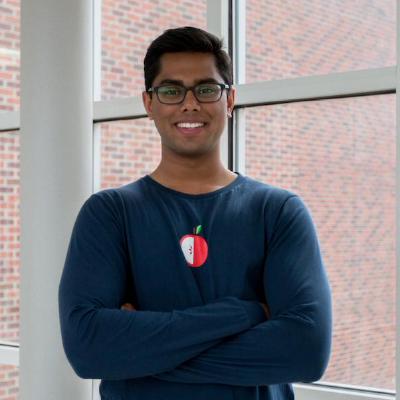 Roi founder Sujith Vishwajith standing beside a window